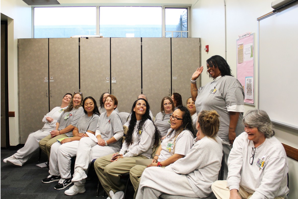 Nine of WA’s 12 prisons host Roots of Success, an environmental literacy class; here, Washington Corrections Center for Women celebrates its first class of graduates. The two class instructors (furthest left in the photo) are also incarcerated, and were certified to teach the class by the curriculum's creater, Dr. Raquel Pinderhughes of University of San Francisco. Photo by Evergreen graduate Joslyn Rose Trivett. 