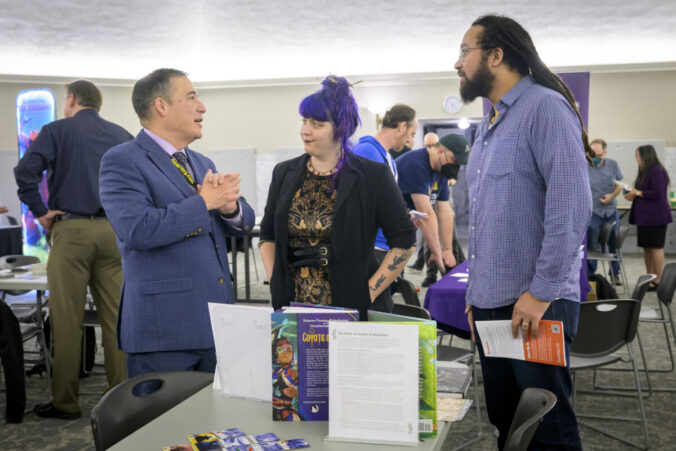 Secretary of State Steve Hobbs talks with Faculty Saltiel and Climate Center Staff