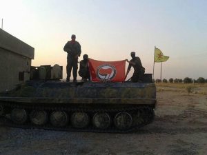 Flag of "Antifascistiche Aktion" held up by YPG volunteers. (Source: It's Going Down)
