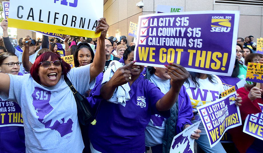 Demonstrators in LA celebrating the California minimum wage raise to $15 an hour by 2022. (Credit: Frederic J. Brown)