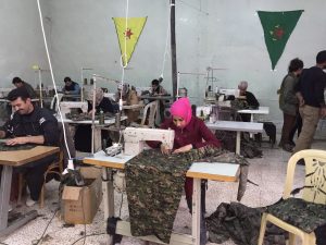 A sewing cooperative in Rojava cmoposed primarily of women. (Source: Wikimedia Commons)