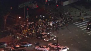 Protesters block an onramp to the interstate in Los Angeles after an ICE raid (credit: CBS Los Angeles)