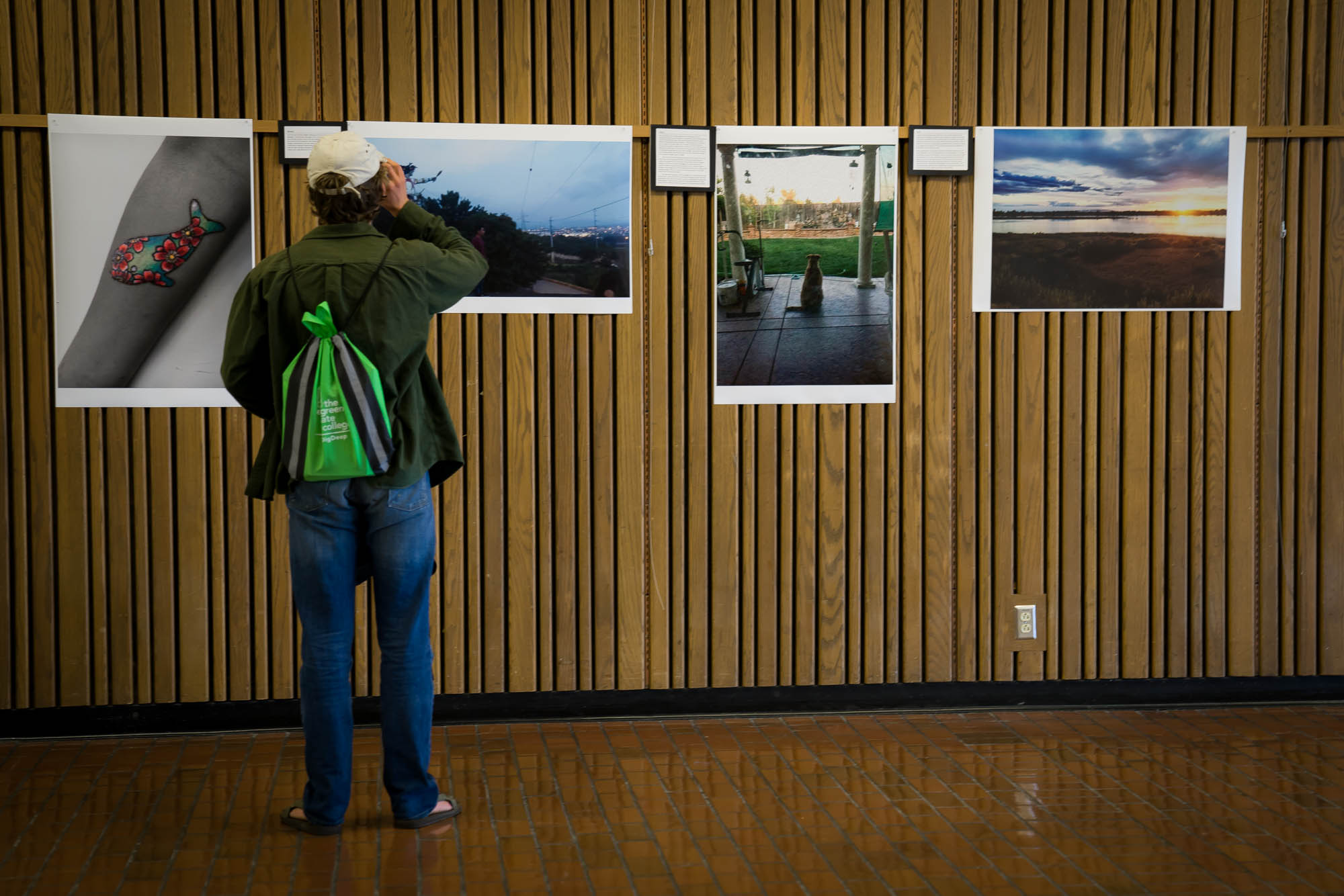 Student checks out TRiO's  photo voice project.