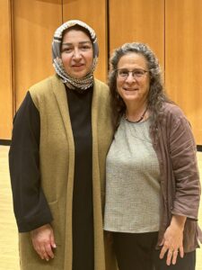 Two women standing together