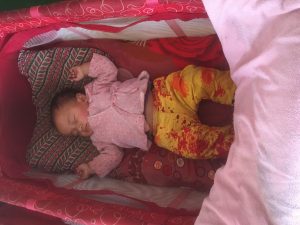 Itsmatika sleeping in crib